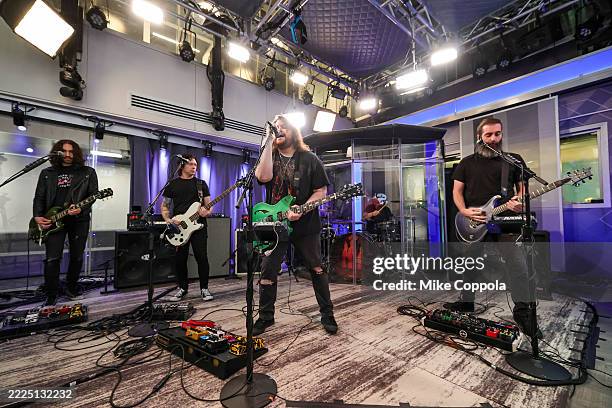 Frank Sidoris, Ronnie Ficarro, Wolfgang Van Halen, Garrett Whitlock, and Jon Jourdan of the band Mammoth perform during their visit to SiriusXM...