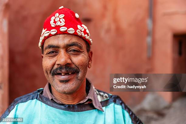 portrait of street musician in marrakesh, morocco - north african culture stock pictures, royalty-free photos & images