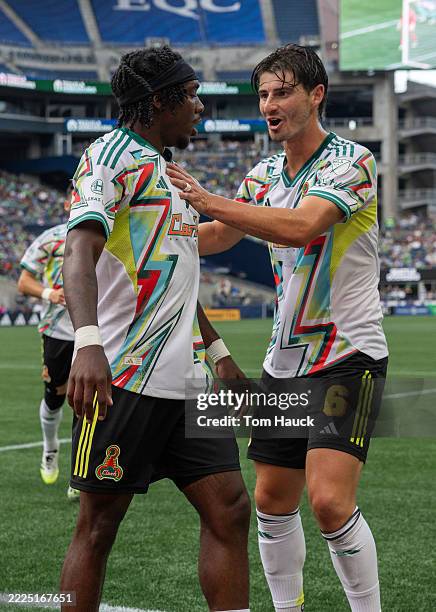Jamar Ricketts of San Jose Earthquakes celebrates a goal with Ian Harkes of San Jose Earthquakes against the Seattle Sounders at Lumen Field on July...