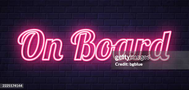 on board - glowing neon text on brick wall background - all aboard stock illustrations