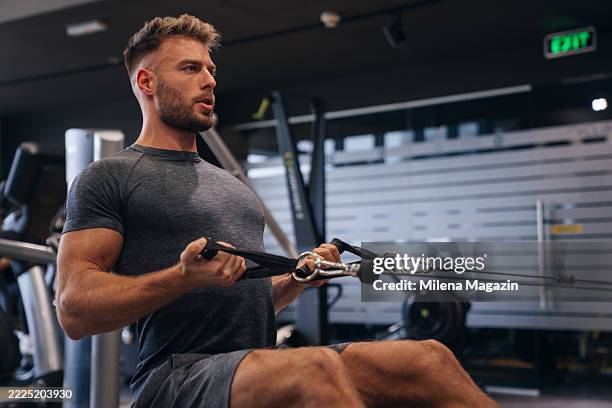 handsome young athlete at the gym - gym stockfoto's en -beelden