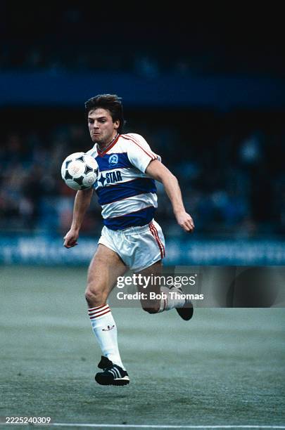 English footballer Gary Bannister, striker with Queens Park Rangers, makes a run with the ball during play in the League Division One match between...