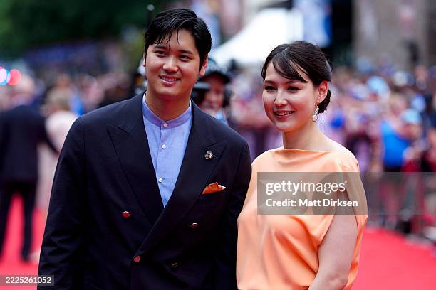 Shohei Ohtani of the Los Angeles Dodgers and his wife Mamiko Tanaka walk on the red carpet ahead of the 2025 MLB All-Star Game at Truist Park on July...