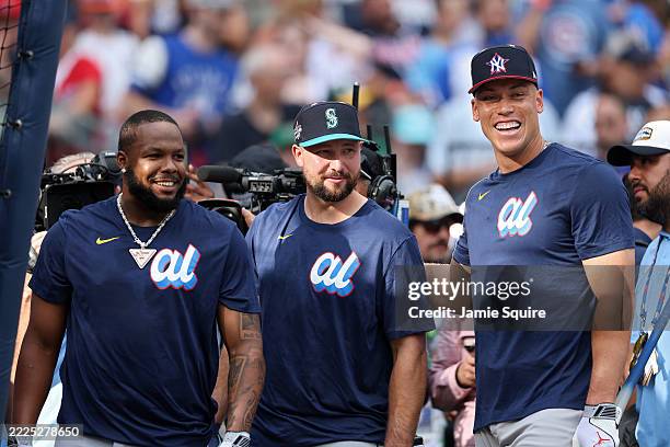 Vladimir Guerrero Jr. #27 of the Toronto Blue Jays, Cal Raleigh of the Seattle Mariners, and Aaron Judge of the New York Yankees look on prior to the...
