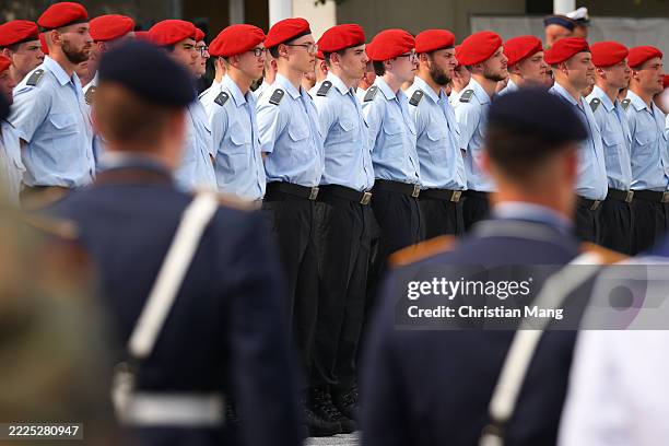 Recruits attend the swearing-in of new recruits of the Bundeswehr, Germany's armed forces, who are taking their pledge of service at a ceremony at...