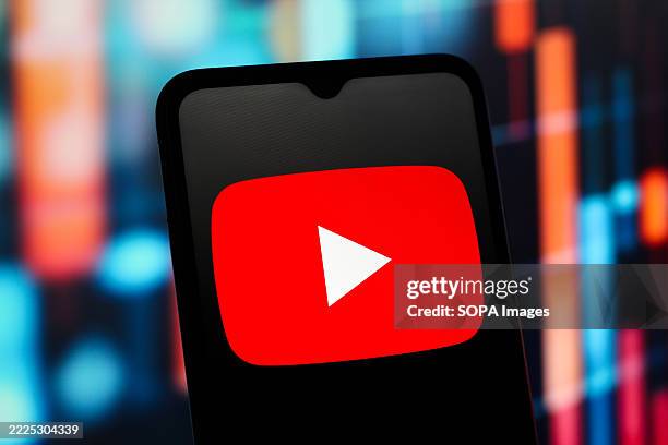 In this photo illustration, the YouTube logo is seen displayed on a smartphone screen.