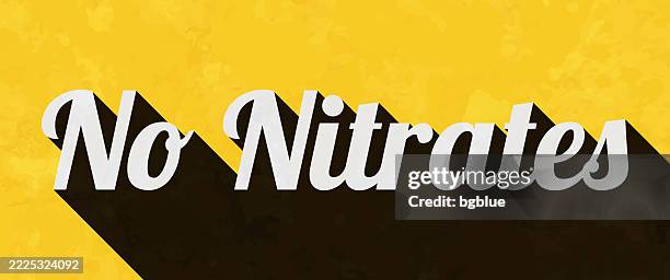 no nitrates - text with long shadow on textured yellow background - fertilizer stock illustrations