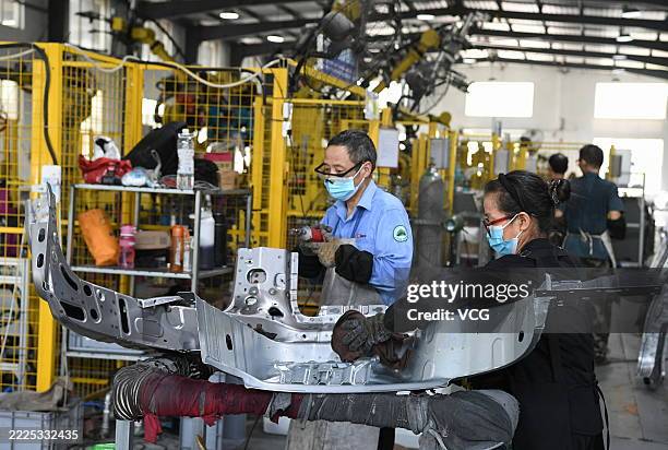 Employees work on the automated production line of Jiatong Automotive Technology Co., Ltd. On July 16, 2025 in Jinhua, Zhejiang Province of China.