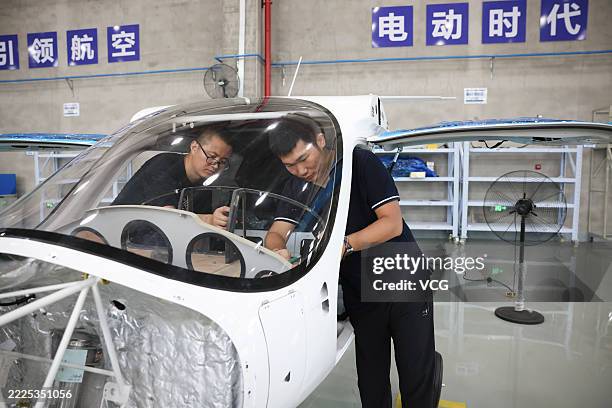 Employees assemble light-sport aircraft at Ruien Aircraft Industry Co., Ltd. On July 16, 2025 in Jiaxing, Zhejiang Province of China.