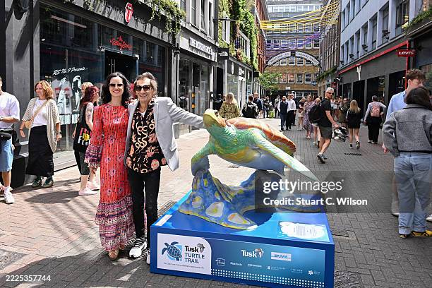 Sally Wood and Ronnie Wood pose at the launch of the Tusk Turtle Trail, a London street art installation at Carnaby Street that convenes renowned...