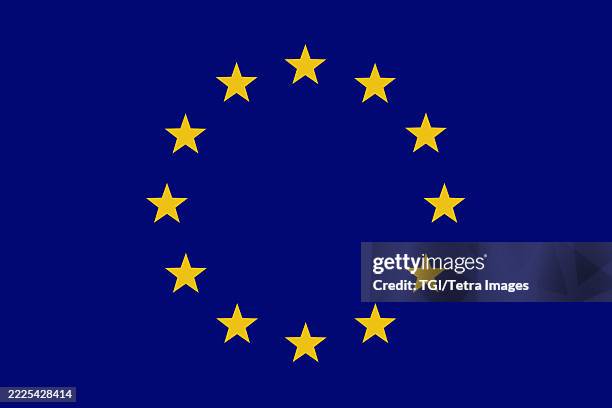 european union flag with twelve yellow stars against blue background - european union flag stock pictures, royalty-free photos & images