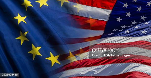american flag and eu flag super-imposed over each other - union européenne photos et images de collection