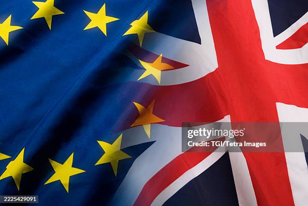 british flag and eu flag super-imposed over one another - eu flag union jack stock pictures, royalty-free photos & images