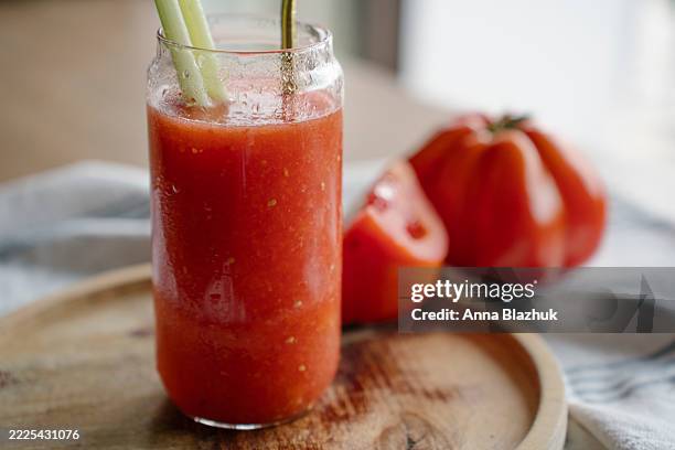 bloody mary cocktail with celery and metal straw on wooden table - tomato juice stock pictures, royalty-free photos & images