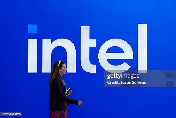 The Intel logo is displayed on a sign in front of Intel headquarters on July 16, 2025 in Santa Clara, California. Intel is laying off nearly 4,000...