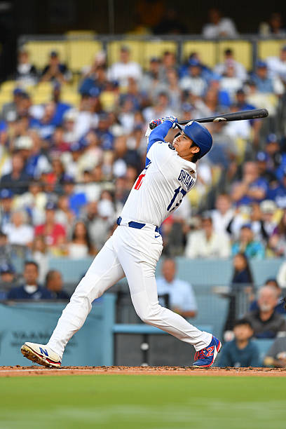 Los Angeles Dodgers designated hitter Shohei Ohtani hits a first inning home run during the MLB game between the Minnesota Twins and the Los Angeles...