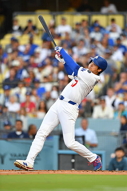 Los Angeles Dodgers designated hitter Shohei Ohtani hits a first inning home run during the MLB game between the Minnesota Twins and the Los Angeles...
