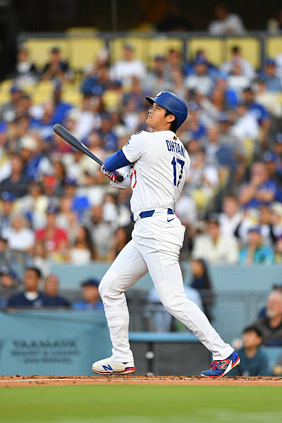 Los Angeles Dodgers designated hitter Shohei Ohtani hits a first inning home run during the MLB game between the Minnesota Twins and the Los Angeles...