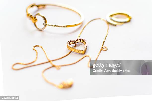 elegant gold and diamond jewelry on white - necklace stock pictures, royalty-free photos & images
