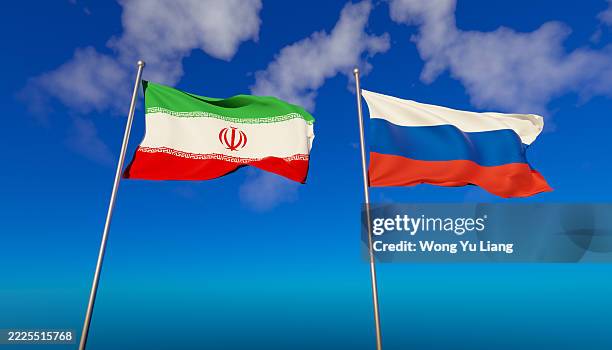 iranian flag and russian flag with blue sky - russian flag stock pictures, royalty-free photos & images
