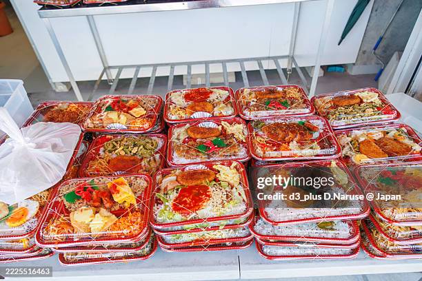 a concession stand selling okinawan-style boxed lunches that are generous in volume and extremely inexpensive.
it was purchased by port officials. - bento box stock pictures, royalty-free photos & images