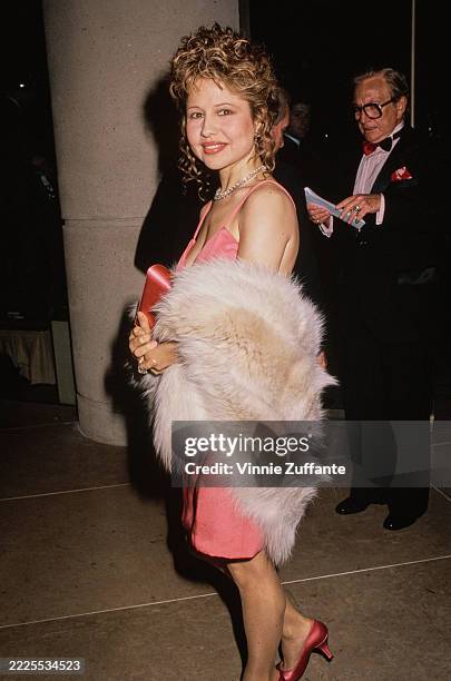 American actress and singer Pia Zadora, wearing a pink mini dress with a fur wrap, attends the 18th Annual American Film Institute Life Achievement...