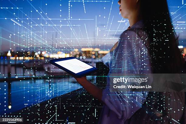 at night, a woman talks to artificial intelligence - special effects stock pictures, royalty-free photos & images