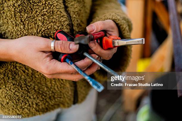 close-up of a female farmer with hand tools - screwdriver stock pictures, royalty-free photos & images