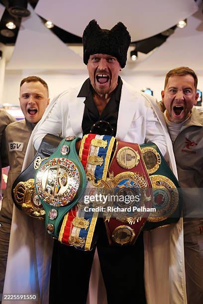 Oleksandr Usyk poses for a photo with his belts during the 'Undisputed' press conference at Wembley Stadium on July 17, 2025 in London, England.
