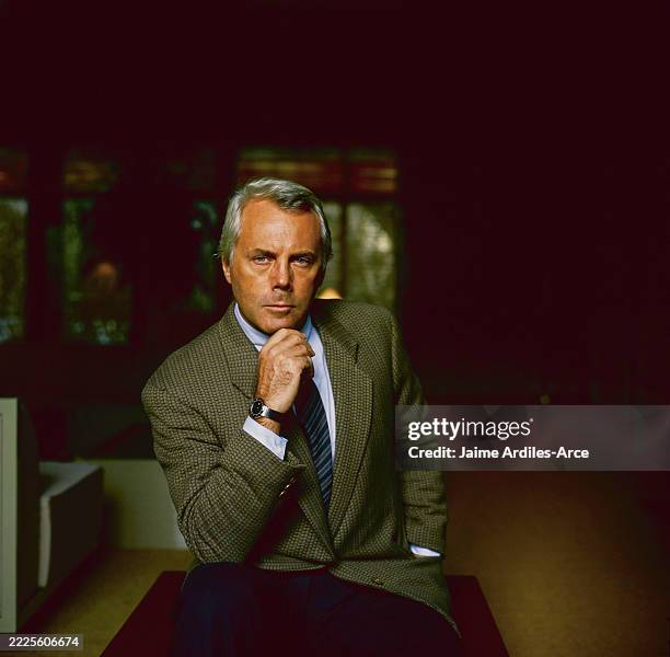 Fashion designer Giorgio Armani resting his chin on his hand, pictured at his home in Forte dei Marmi on the Versilia coast of Tuscany.