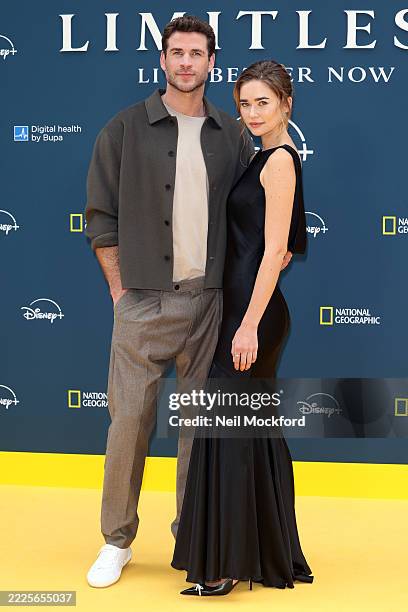 Liam Hemsworth and Gabriella Brooks attend the "Limitless: Live Better Now" UK Premiere at Odeon Luxe Leicester Square on July 17, 2025 in London,...