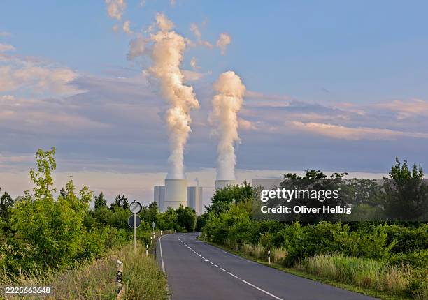 lippendorf power plant emitting steam near leipzig in germany - greenhouse gas stock pictures, royalty-free photos & images