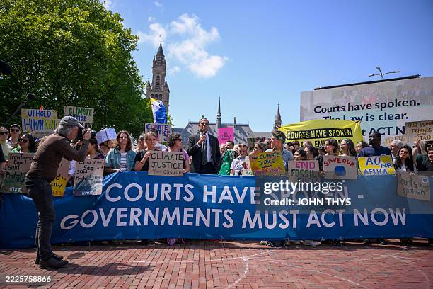 Vanuatu's Climate Change Minister Ralph Regenvanu delivers a speech as he attends a demonstration ahead of the International Court of Justice session...