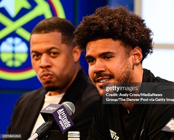 Denver Nuggets basketball player, Cam, Johnson, right, during his introductory press conference at Ball Arena in Denver, Colorado, on Friday, July...