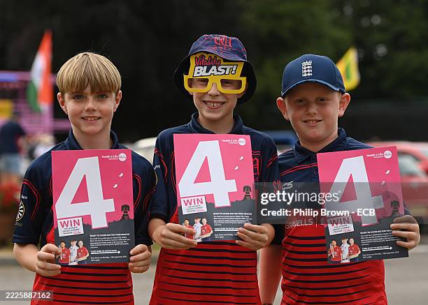 Three boys pose for a photograph after the Vitality Blast League Two match between Glamorgan and Kent at Sophia Gardens on July 18, 2025 in Cardiff,...