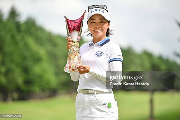 Yuki Ichinose of Japan poses with the trophy after winning the tournament following the final round of AOMORI LADIES OPEN GOLF TOURNAMENT at Aomori...
