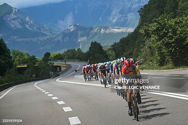 Lidl - Trek team's Belgian rider Jasper Stuyven leads the pack of riders during the 18th stage of the 112th edition of the Tour de France cycling...