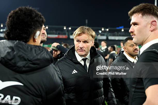 Coach Scott Robertson of New Zealand shakes hands with Christian Lio-Willie of New Zealand during the Test Match between New Zealand All Blacks and...