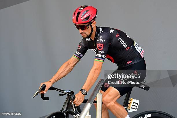 Cyclist Julian Alaphilippe of the Tudor Pro Cycling Team participates in the official presentation of the professional cyclists on the podium at the...