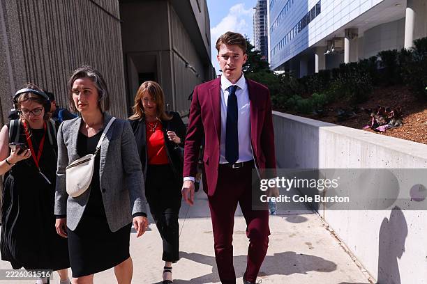 Carter Hart, centre, leaves the London Courthouse, in London, Ontario, Canada after being acquitted of sexual assault charges, on July 24, 2025....