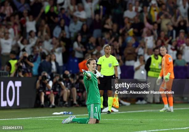 Ann-Katrin Berger of Germany celebrates after saving the seventh penalty from Alice Sombath of France in the penalty shoot out during the UEFA...
