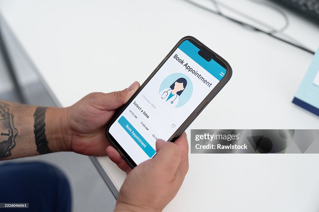 Patient using a mobile app to book a doctor appointment