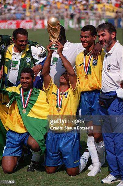 ROMARIO SINKS TO HIS KNEES HOLDING THE WORLD CUP AS HE CELEBRATES WINNING THE 199WORLD CUP AFTER THE ITALY V BRAZIL 1994 WORLD CUP FINAL AT THE ROSE...