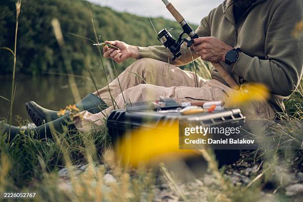man on deep rest travel. river fishing in lush green nature - fishing tackle stock pictures, royalty-free photos & images