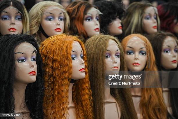 Booth displaying different styles of hair extensions during Day Six of the K Days summer festival in Edmonton, Alberta, Canada, on July 23, 2025.