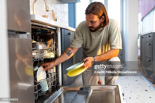 dishwasher is my favourite home appliance - unloading stock pictures, royalty-free photos & images