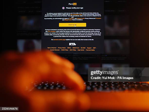 An online adult website asks to verify the age of the user on a laptop in London, part of the new rules set out in the Online Safety Act. Speaking...