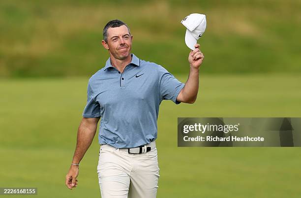 Rory McIlroy of Northern Ireland acknowledges the crowd as he walks to the 18th green during day four of The 153rd Open Championship at Royal...