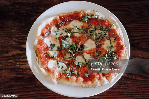 margherita pizza at restaurant - cheese pizza stock pictures, royalty-free photos & images