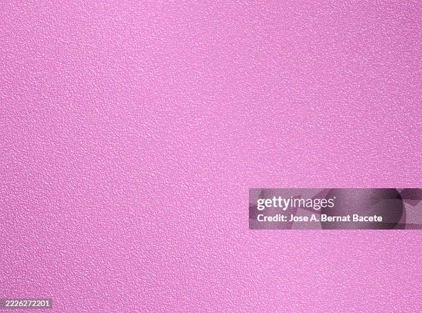 full frame, smooth rough texture of a bright green plastic sheet. - plastic laminate stock pictures, royalty-free photos & images